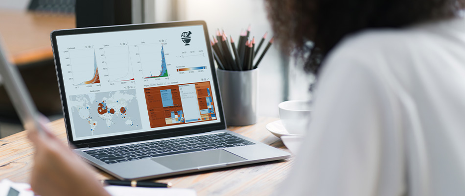 A manufacturing engineer examines an executive dashboard tracking supply chain issues and highlighting anomalies and outliers in a pharmaceutical manufacturing workflow.